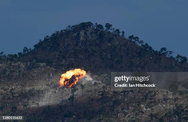 An explosion from a laser guided GBU-12 bomb is seen after being dropped from a F/A-18F Super Hornet during Exercise Nigrum Pugio on October 14, 2020...