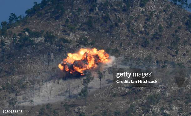 An explosion from a laser guided GBU-12 bomb is seen after being dropped from a F/A-18F Super Hornet during Exercise Nigrum Pugio on October 14, 2020...