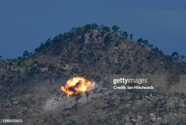 An explosion from a laser guided GBU-12 bomb is seen after being dropped from a F/A-18F Super Hornet during Exercise Nigrum Pugio on October 14, 2020...