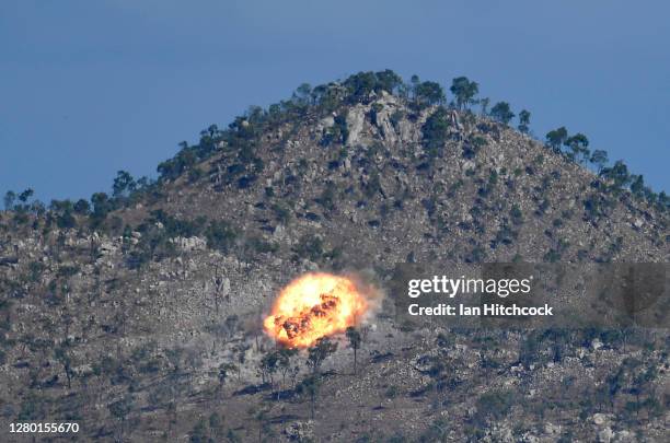 An explosion from a laser guided GBU-12 bomb is seen after being dropped from a F/A-18F Super Hornet during Exercise Nigrum Pugio on October 14, 2020...