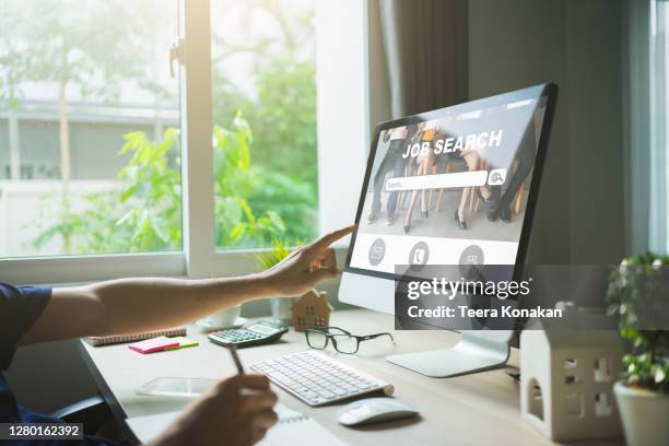 job search concept, businessman clicking internet job search page on computer touch screen. - web page foto e immagini stock