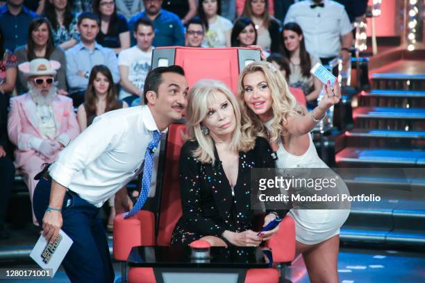 Nicola Savino, Amanda Lear and Valeria Marini taking a selfie during the television program Quelli che il calcio. Milan , May 11th, 2014