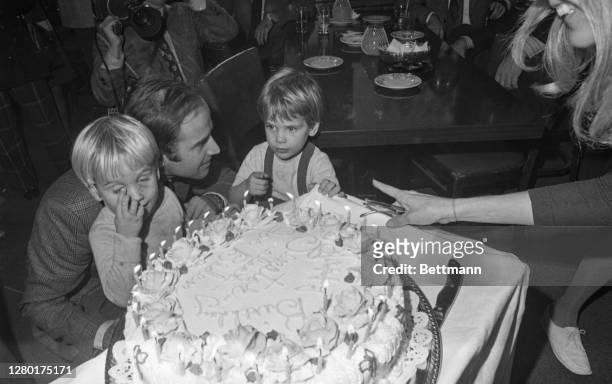Senator-elect Joseph Biden cut his 30th birthday cake at a party in Wilmington, November 20th. His sons, Hunter and Beau, wait for the first piece....