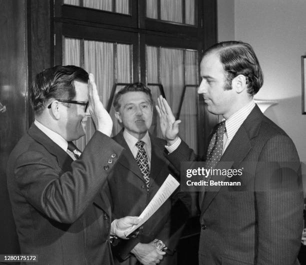Democratic Senator-elect Joseph Biden, of Delaware is seen here as he takes his oath of citizenship as he checks in at the office of the Secretary of...