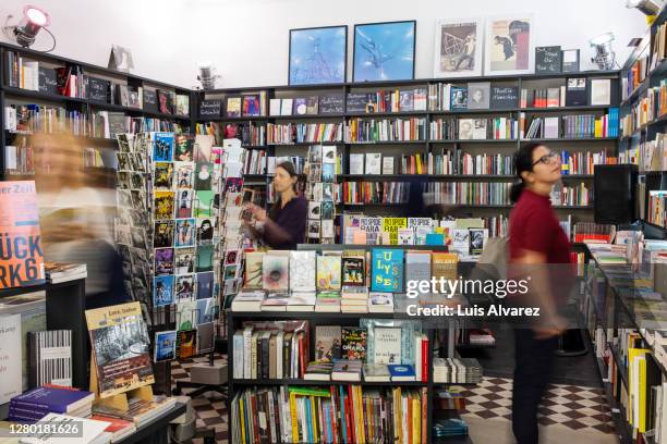 interior of a bookstore with customers - librairie photos et images de collection