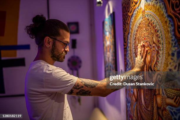 man on art exhibition - art show stock pictures, royalty-free photos & images