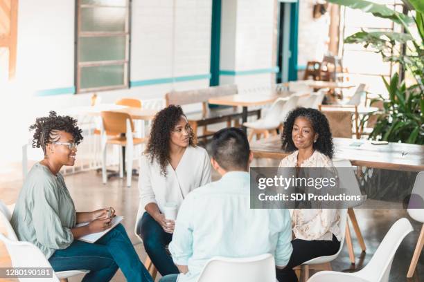 multi-ethnic group meets regularly with therapist - vulnerability management stock pictures, royalty-free photos & images