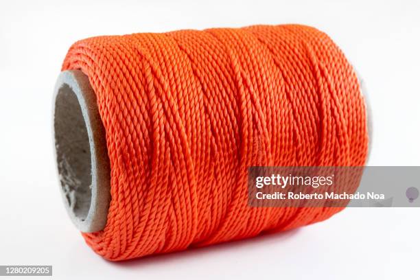 String Thread Orange Orange Fabric Rolls Photos and Premium High Res Pictures - Getty Images