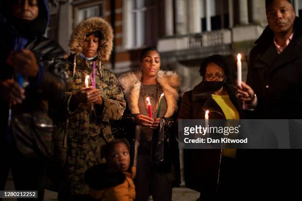 Small group hold a candlelit vigil to mark what would have been the birthday of George Floyd, in Windrush Square in Brixton on October 14, 2020 in...