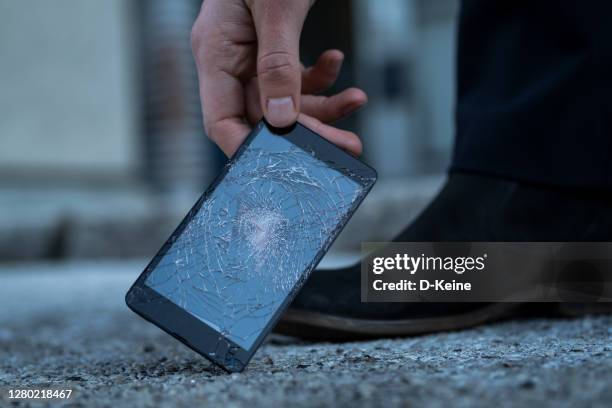 broken smartphone - broken phone accident stock pictures, royalty-free photos & images