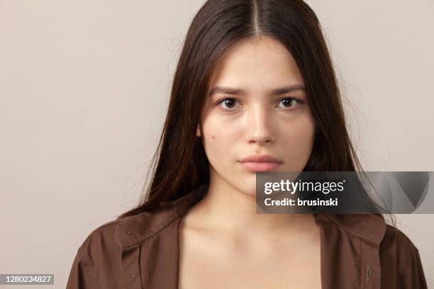 studio portrait of a teen girl - brown eye stock pictures, royalty-free photos & images