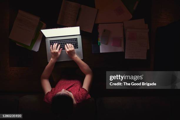 woman working from home late at night - working late imagens e fotografias de stock