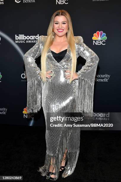 In this image released on October 14, Kelly Clarkson poses backstage at the 2020 Billboard Music Awards, broadcast on October 14, 2020 at the Dolby...