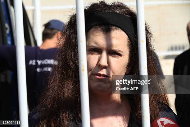Evangelia Roupa, a suspected member of the far-left extremist group Revolutionary Struggle, speaks to reporters on October 5, 2011 outside Korydallos...
