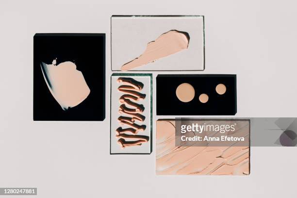 blocks and glasses with foundation strokes - concealer stock pictures, royalty-free photos & images