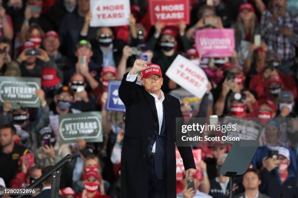 President Donald Trump speaks to supporters during a rally at the Des Moines International Airport on October 14, 2020 in Des Moines, Iowa. According...