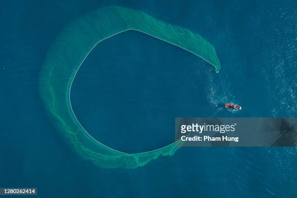 fishing boat on the sea - fishing boat net stock pictures, royalty-free photos & images