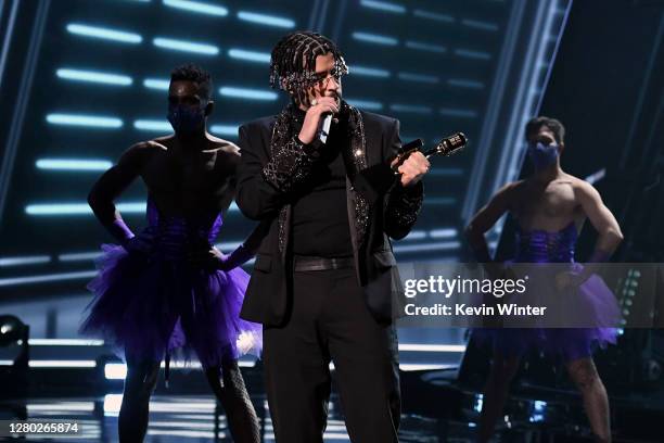 In this image released on October 14, Bad Bunny accepts the Top Latin Artist Award onstage at the 2020 Billboard Music Awards, broadcast on October...