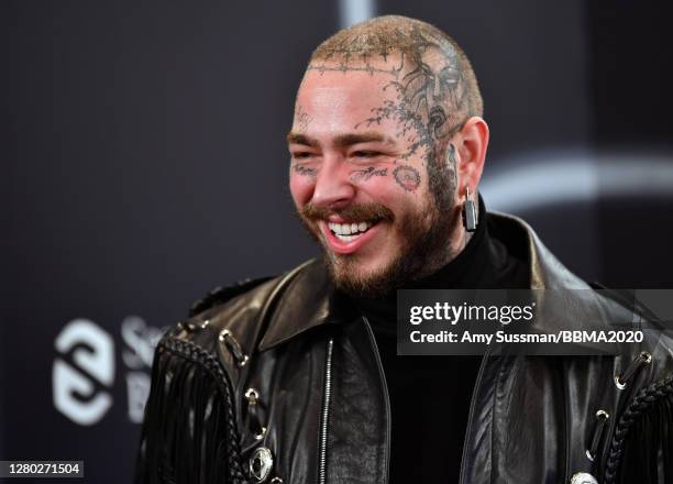 In this image released on October 14, Post Malone poses backstage at the 2020 Billboard Music Awards, broadcast on October 14, 2020 at the Dolby...