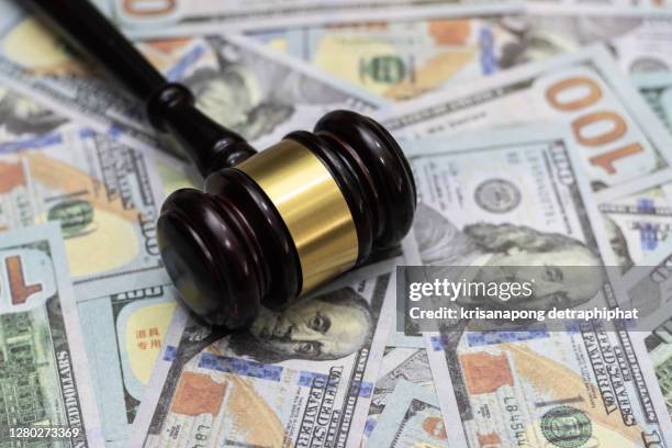 money and hammer,wooden gavel and dollar banknotes - veiling stockfoto's en -beelden