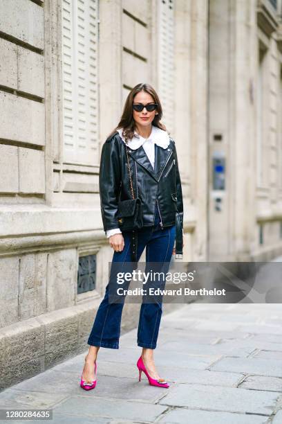 Therese Hellström wears sunglasses, a white shirt / blouse with ruffles from Paul & Joe, a black leather jacket from CBLOMST, a Chanel bag, blue...