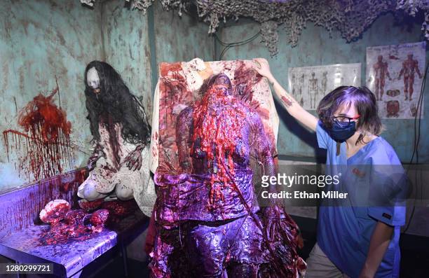 An actress waits for guests to pass by a medical-themed set at the Fright Ride immersive haunted attraction on October 14, 2020 in Las Vegas, Nevada....