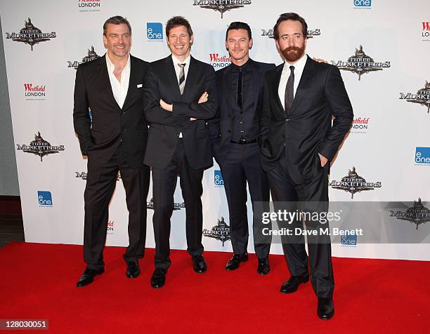 Actor Ray Stevenson, director Paul WS Anderson, with actors Luke Evans and Matthew Macfadyen attends the world premiere of 'The Three Musketeers in...