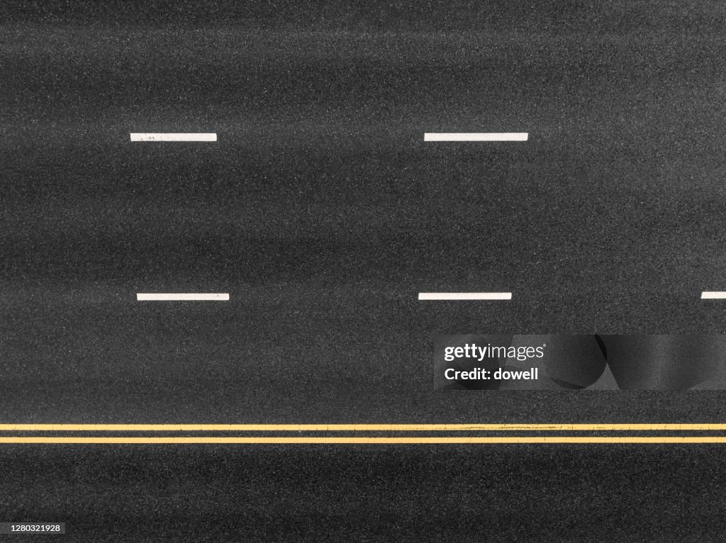 New asphalt road with traffic sign