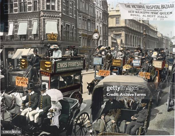 Colorized photo of traffic on a busy street, London, England, 1897. Among the visible vehicles are horse-drawn omnibuses, hansoms, private broughams,...