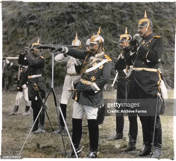 Colorized photo of German Emperor Wilhelm II points as he stands with his staff officers, Berlin, Germany, 1907.