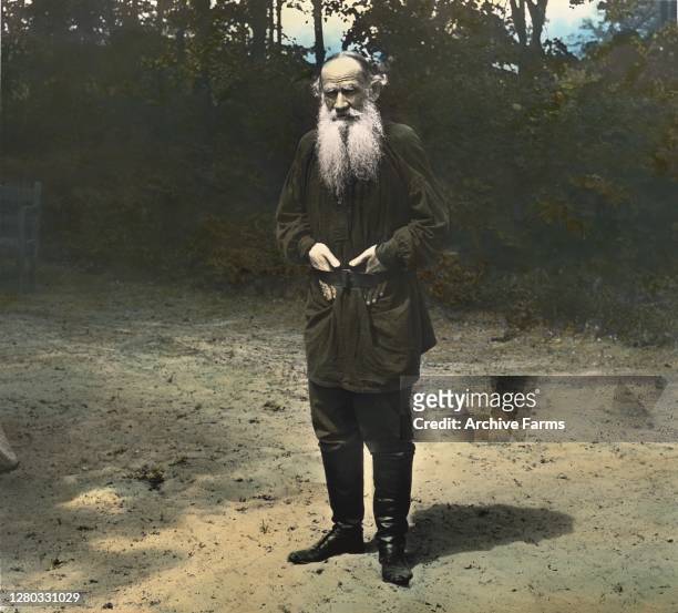 Colorized portrait of Russian writer Count Leo Tolstoy standing on the grounds of his estate Yasnaya Polyana, in the Tula region, Russia, 1901.