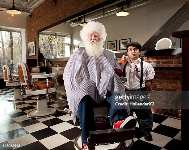 man with afro with barber - men doing quirky things stock-fotos und bilder