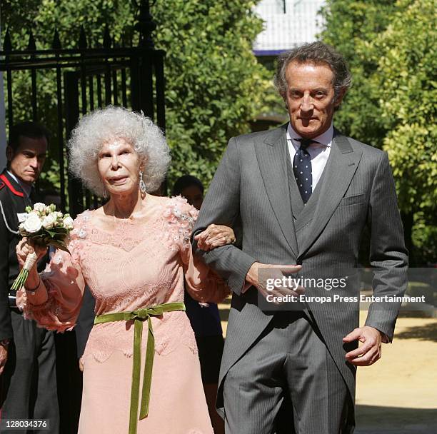 Duchess of Alba, Cayetana Fitz-James Stuart and Alfonso Diez leave Duenas Palace to welcome people on October 5, 2011 in Seville, Spain.