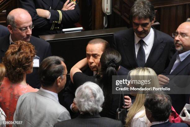 The deputy of the PDL Jole Santelli embraces the Prime Minister Silvio Berlusconi in the Chamber of Deputies during the session for confidence on the...