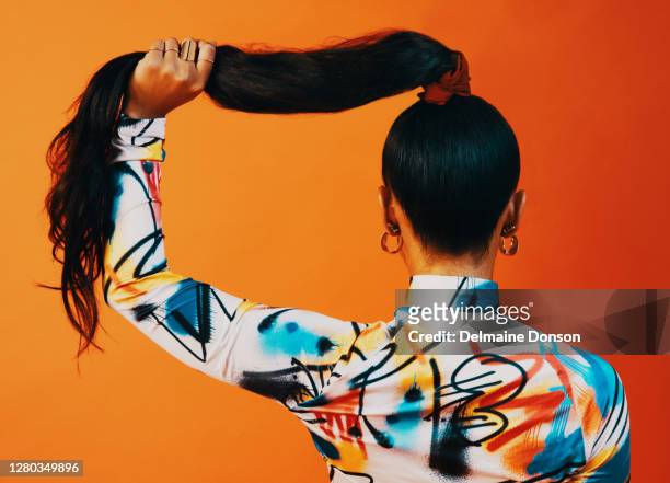 embrace the power of the pony - black woman hair back stock pictures, royalty-free photos & images