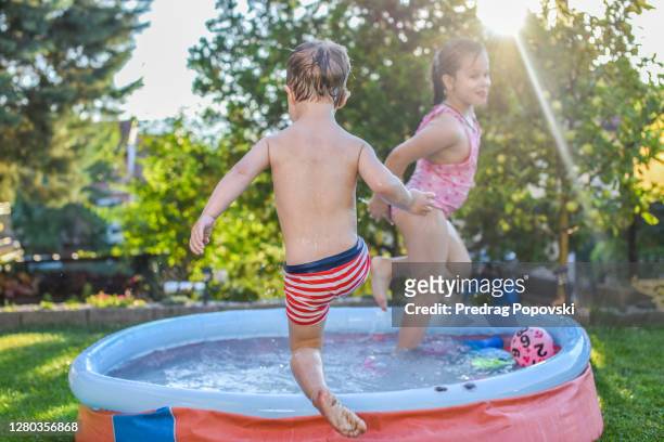happy family summer days in backyard - family garden play area stock pictures, royalty-free photos & images