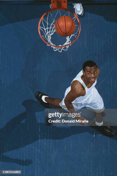 Billy Knight, Guard for the University of California, Los Angeles UCLA Bruins watches the ball drop through the next after scoring during the NCAA...