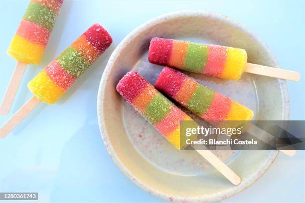 fresh rainbow popsicles - ice lolly stock pictures, royalty-free photos & images