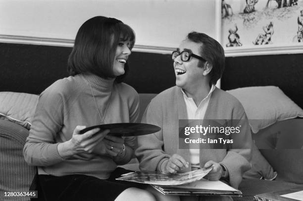 Scottish actor and comedian Ronnie Corbett choosing records with his wife, actress Anne Hart, January 1969.