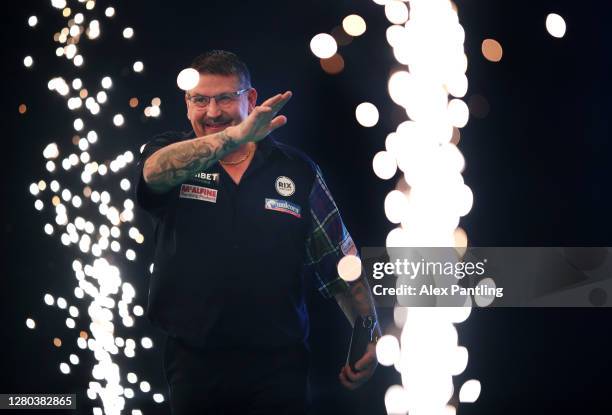 Gary Anderson of Scotland makes his way out for his semi-final match against Glen Durrant of England during the Unibet Premier League Play-Offs at...