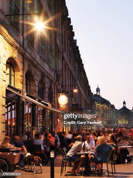 busy street at night in bordeaux - bar atmosphere stock pictures, royalty-free photos & images