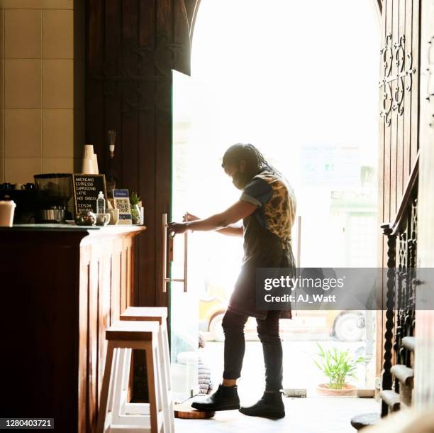 reopening of a barista - person opening door silhouette stock pictures, royalty-free photos & images