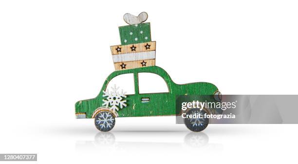 wooden car with gift boxes on a isolated on white background. christmas concept - new car bow stock pictures, royalty-free photos & images