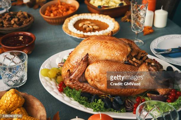 stuffed turkey for thanksgiving holidays - roast turkey stock pictures, royalty-free photos & images
