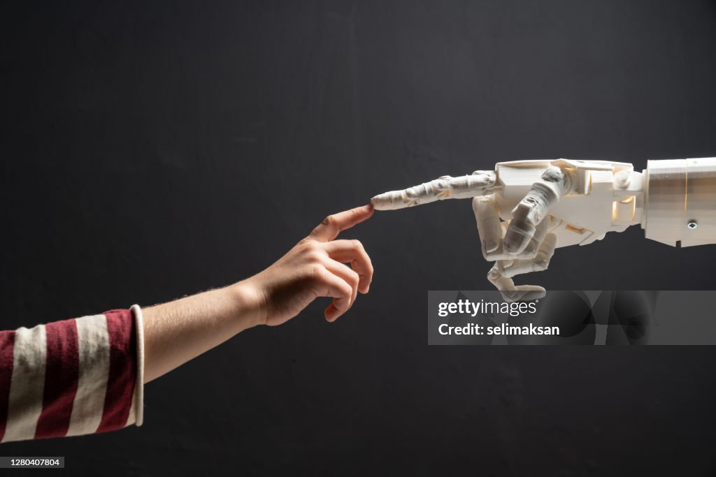 Human Finger Touches Robotic Finger