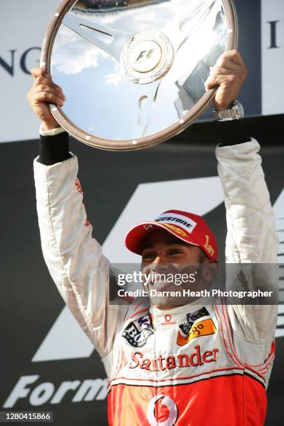 British McLaren Formula One driver Lewis Hamilton on the winners podium celebrates winning the 2008 Australian Grand Prix at the Melbourne Grand Prix...