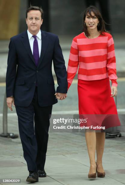 British Prime Minister David Cameron and his wife Samantha arrive at Manchester Central for his speech at the annual Conservative Party Conference at...