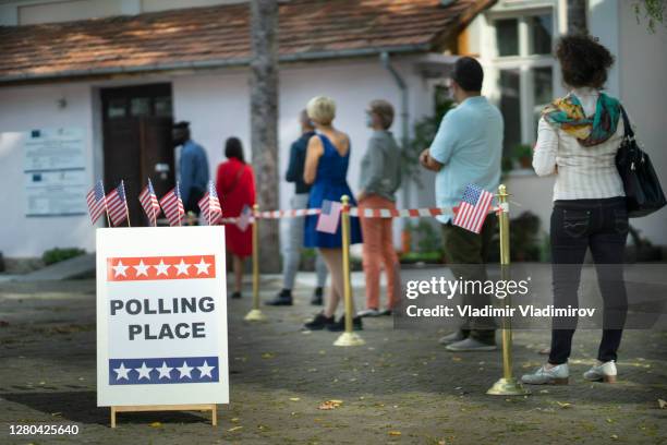 waiting in line on election day - political party lines stock pictures, royalty-free photos & images