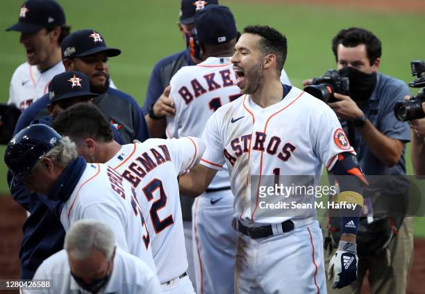 Carlos Correa of the Houston Astros celebrates a walk off home run to win 4-3 against Tampa Bay Rays in Game Five of the American League Championship...