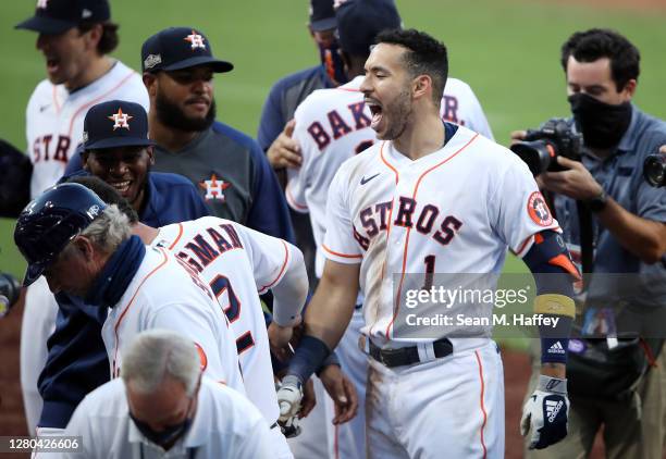 Carlos Correa of the Houston Astros celebrates a walk off home run to win 4-3 against Tampa Bay Rays in Game Five of the American League Championship...